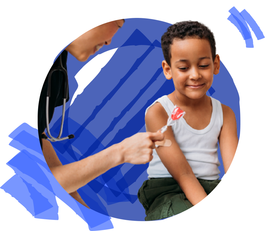 A child smiles while a healthcare professional prepares to administer a vaccine.