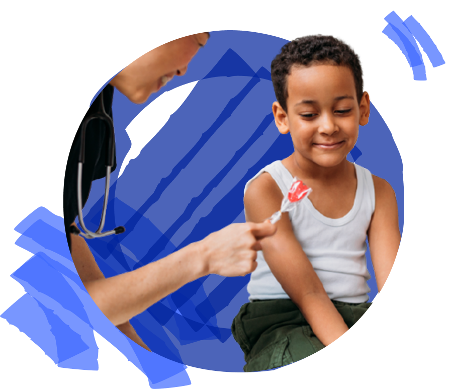A child is smiling while a healthcare professional offers a lollipop.